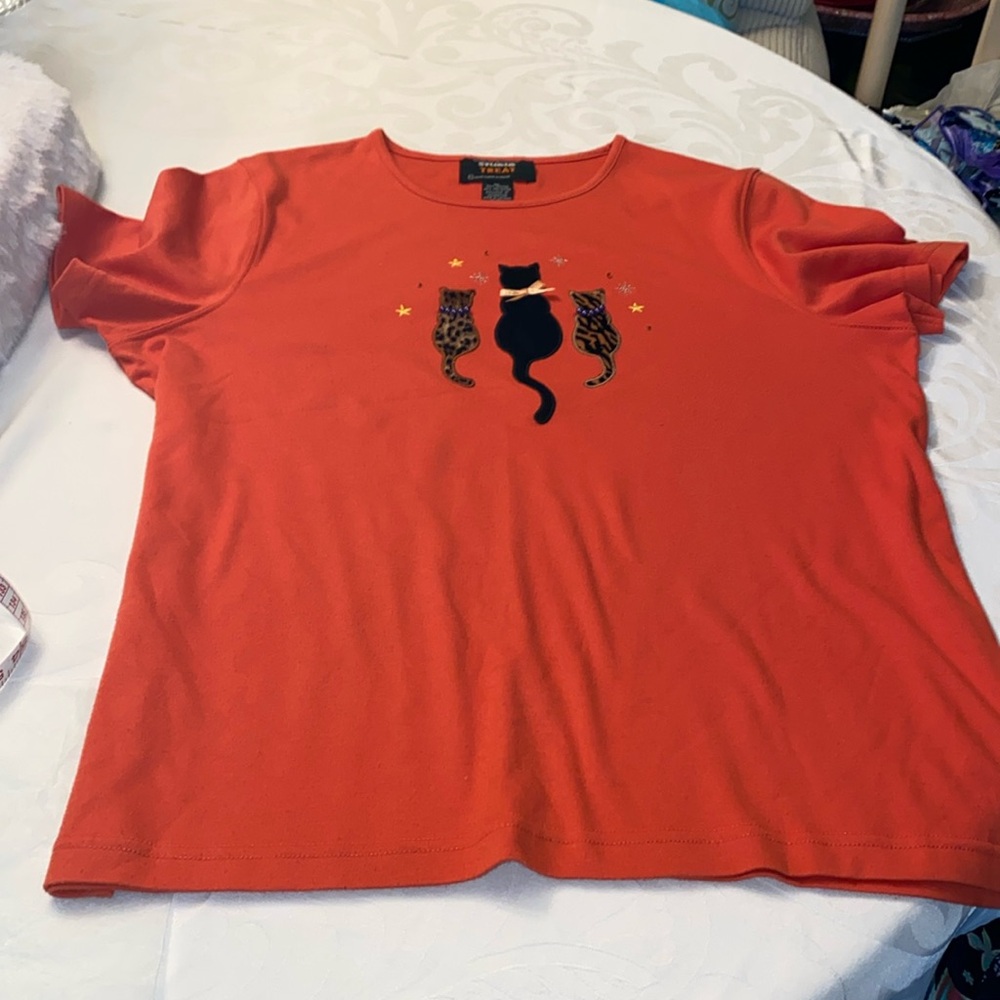 Orange scoop neck, short sleeve T-shirt with cats on the front